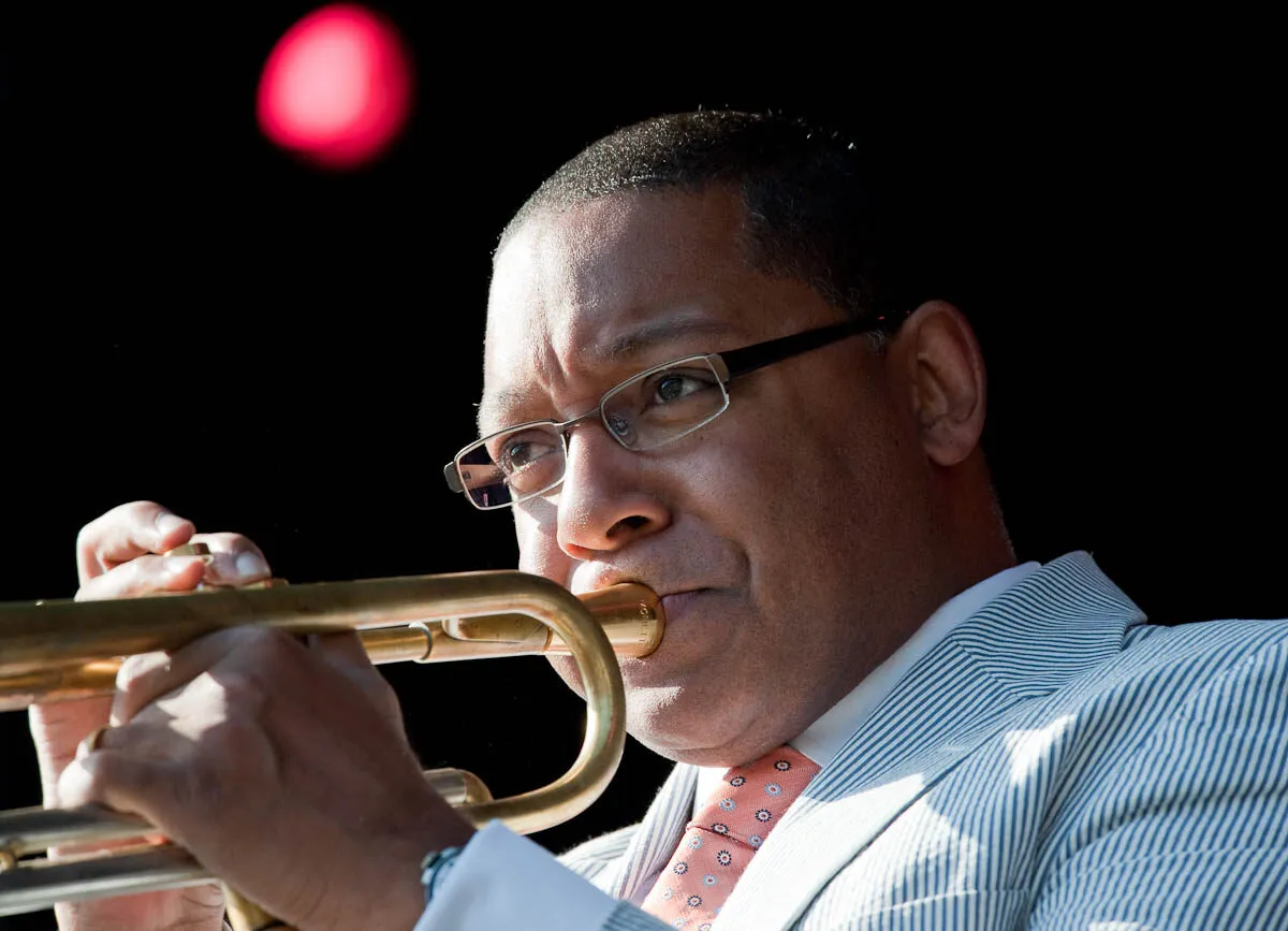 Wynton Marsalis playing trumpet outdoors