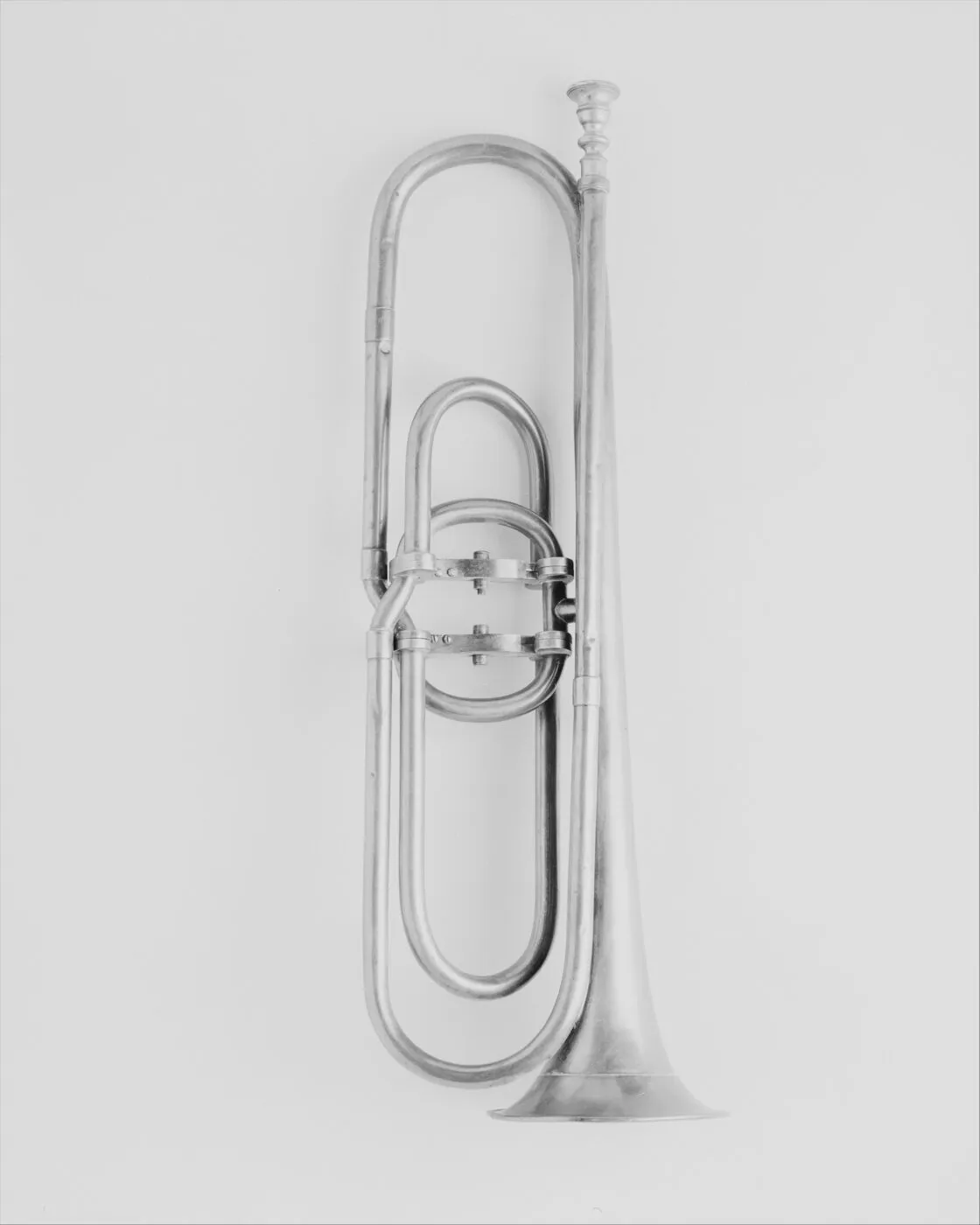 An early valve trumpet with a long loop of tubing and a valve mechanism